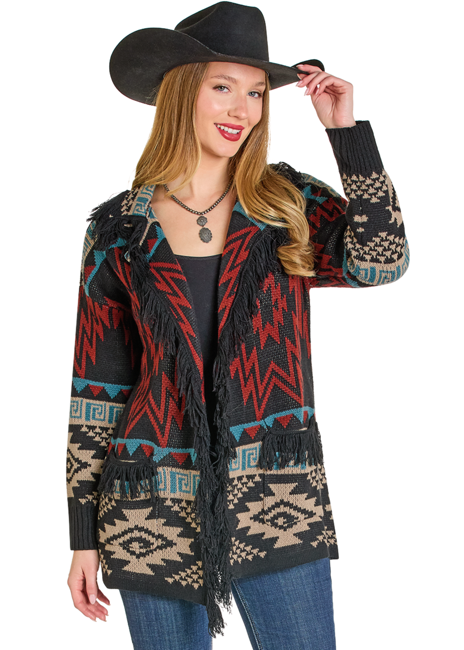 Woman wearing a patterned jacket with fringes and a cowboy hat on a white background