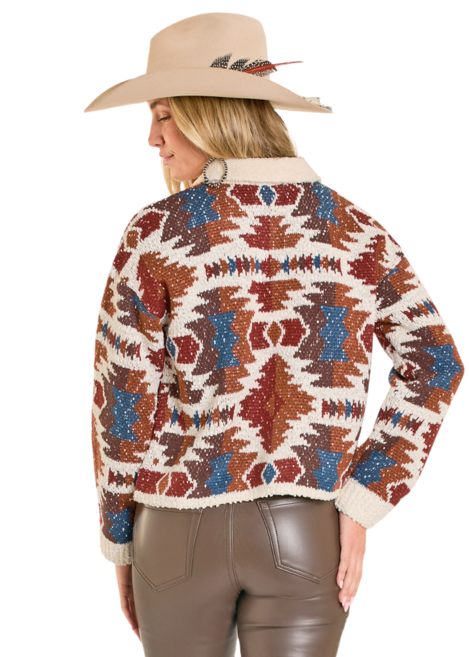 Person wearing a patterned sweater and cowboy hat on a white background