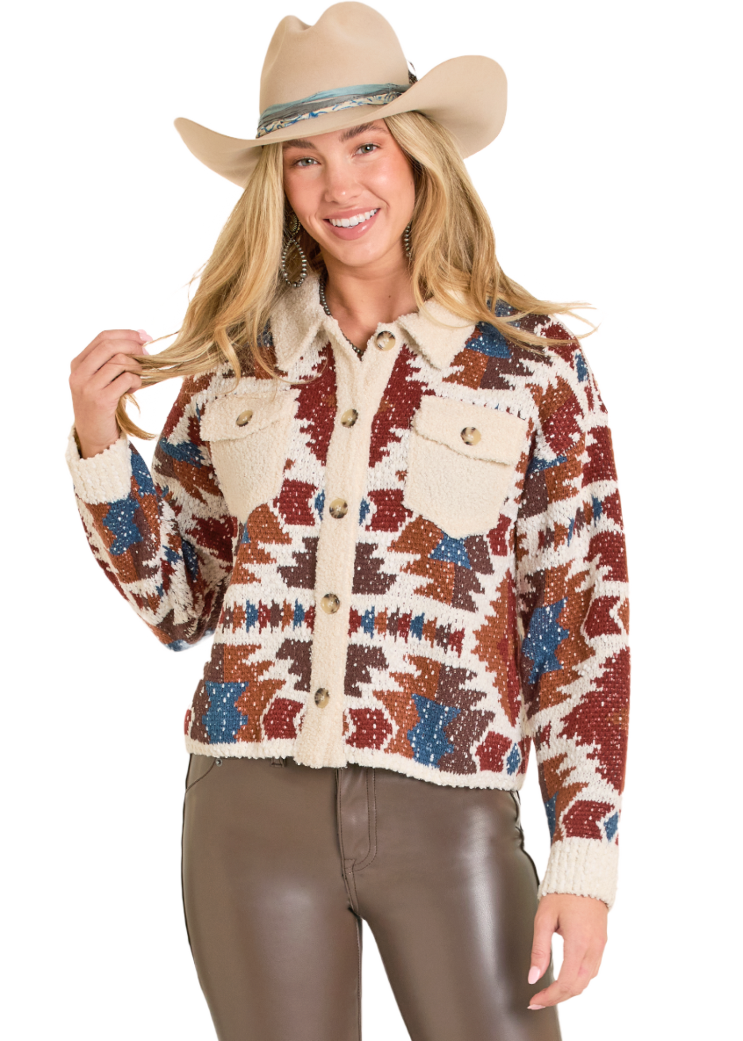Woman wearing a patterned jacket and cowboy hat on a white background