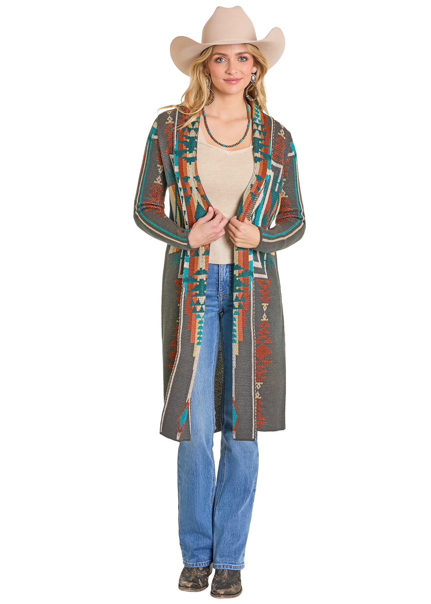 Woman wearing a patterned cardigan, jeans, and a cowboy hat on a white background