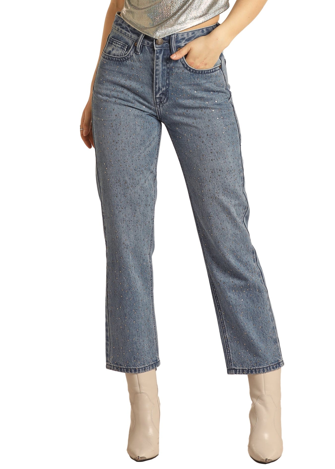 Woman wearing a silver tank top, blue jeans, and a black cowboy hat on a white background