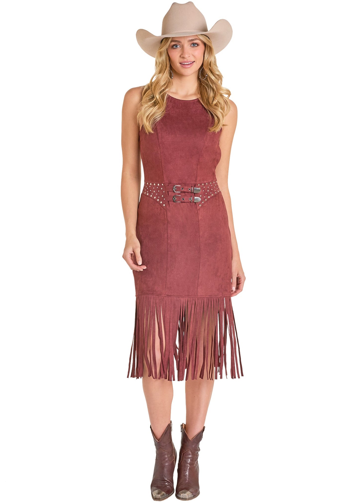 Woman wearing a maroon fringe dress with a belt and cowboy hat on a white background
