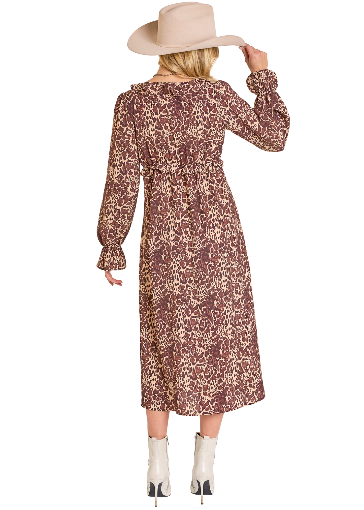 Woman wearing a patterned dress and beige hat on a white background