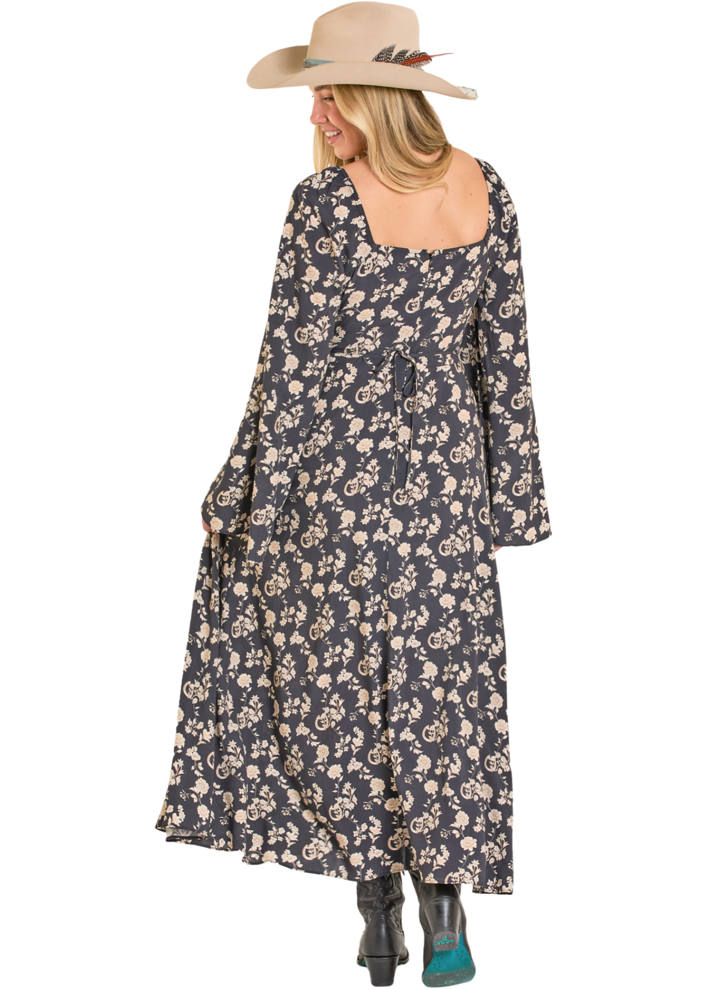 Woman wearing a floral dress and hat on a white background