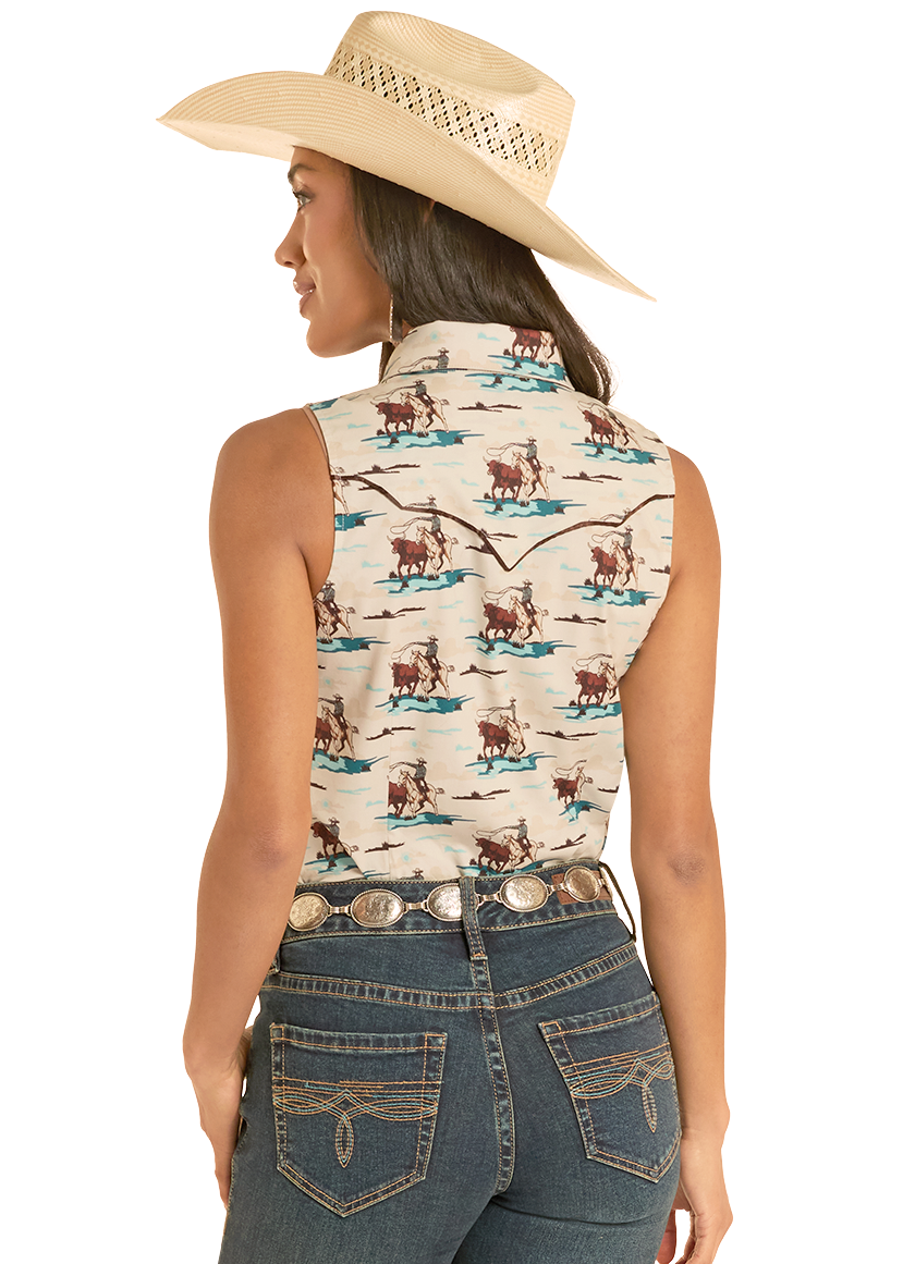 Woman wearing a sleeveless patterned top and blue jeans with a cowboy hat on a white background