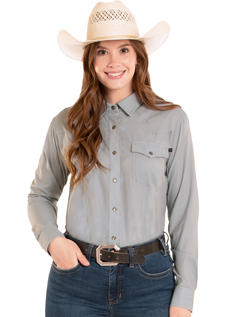 Woman wearing a gray long-sleeve shirt, blue jeans, and a beige cowboy hat on a white background