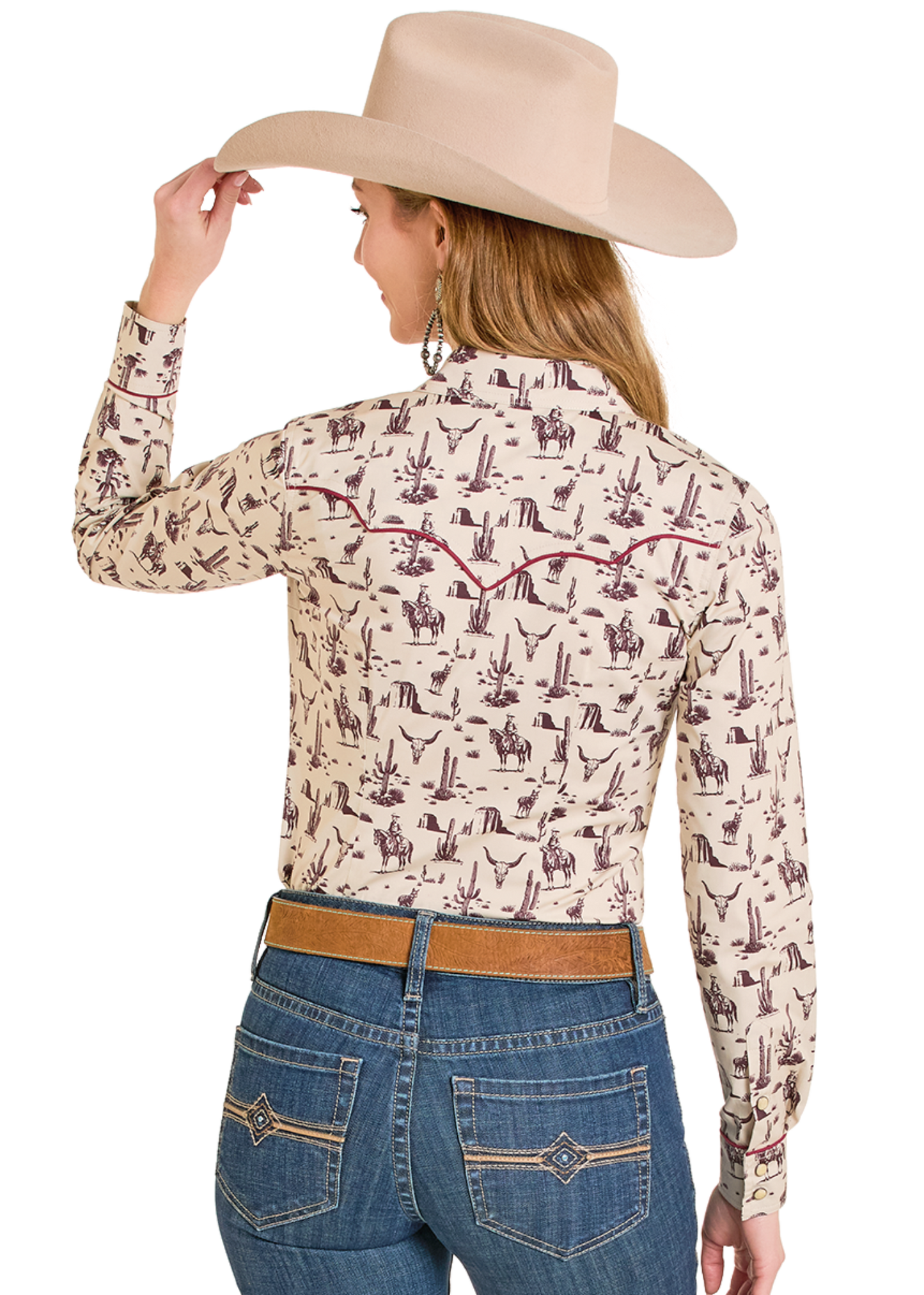 Person wearing a patterned long-sleeve shirt and jeans with a cowboy hat on a white background
