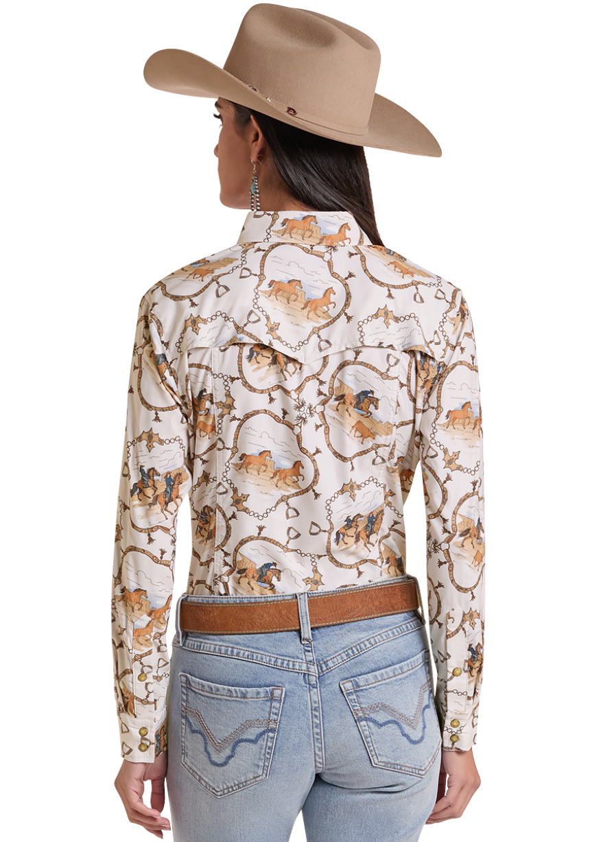 A woman shown from the back wearing a cream western-style long-sleeve shirt with a brown and gold floral vine pattern, a tan cowboy hat, a brown belt, and light blue jeans against a plain white background.