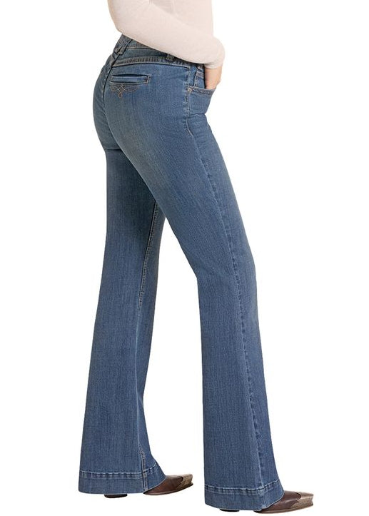 Wide view of woman wearing trouser jeans with a back welt pocket. 