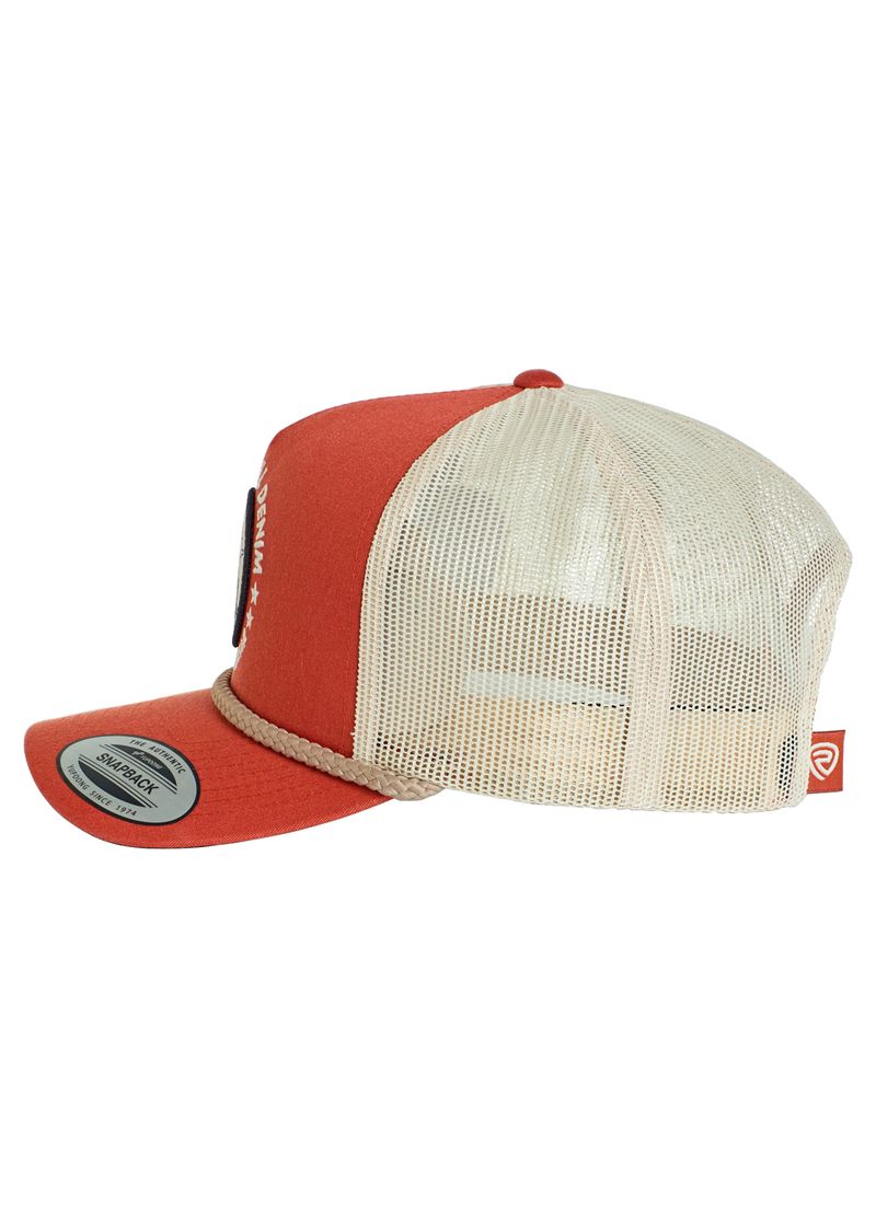 A Rock & Roll Denim Rock & Roll Skeleton Cap trucker hat in red and beige features a mesh back, solid red front panel and brim, rope detail above the brim, adjustable snapback, and a small side tag. Shown from a side angle.