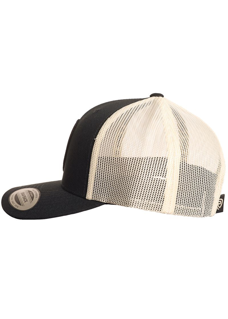 The Rock & Roll Denim Buckin' Bronc Cap features black and white panels, a curved bill, beige mesh back panels, and an adjustable snapback for a perfect fit. Shown side view on a white background.