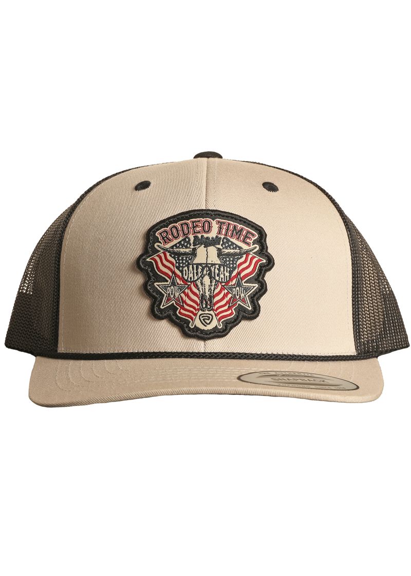 The Rock & Roll Denim Dale Brisby Rodeo Time Cap is a beige and black mesh snapback featuring a front patch with "Rodeo Time Dale Brisby," a steer skull, two red flags, and a gold rodeo belt buckle graphic.