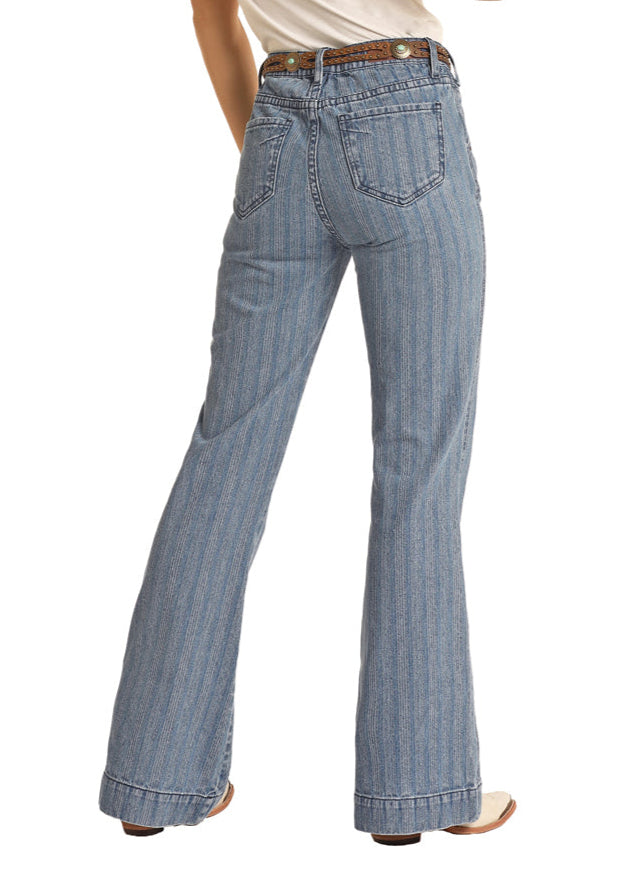 Woman wearing blue jeans and a white shirt with a straw hat on a white background
