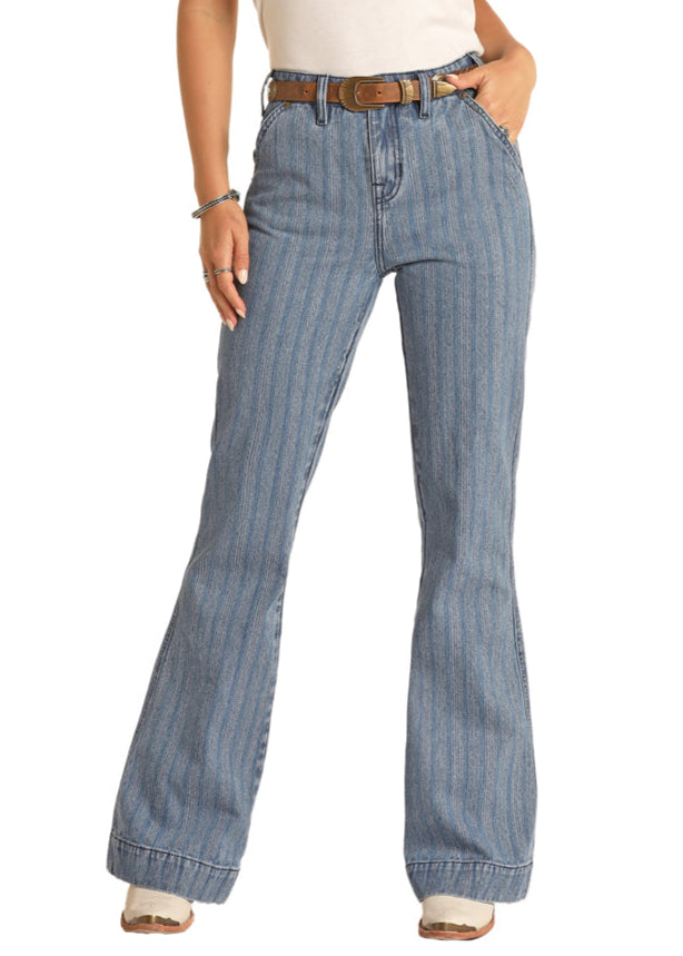 Woman wearing a white shirt, blue jeans, and a cowboy hat on a white background