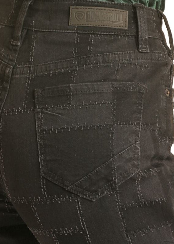 Person wearing a green velvet tank top and black cargo pants on a white background