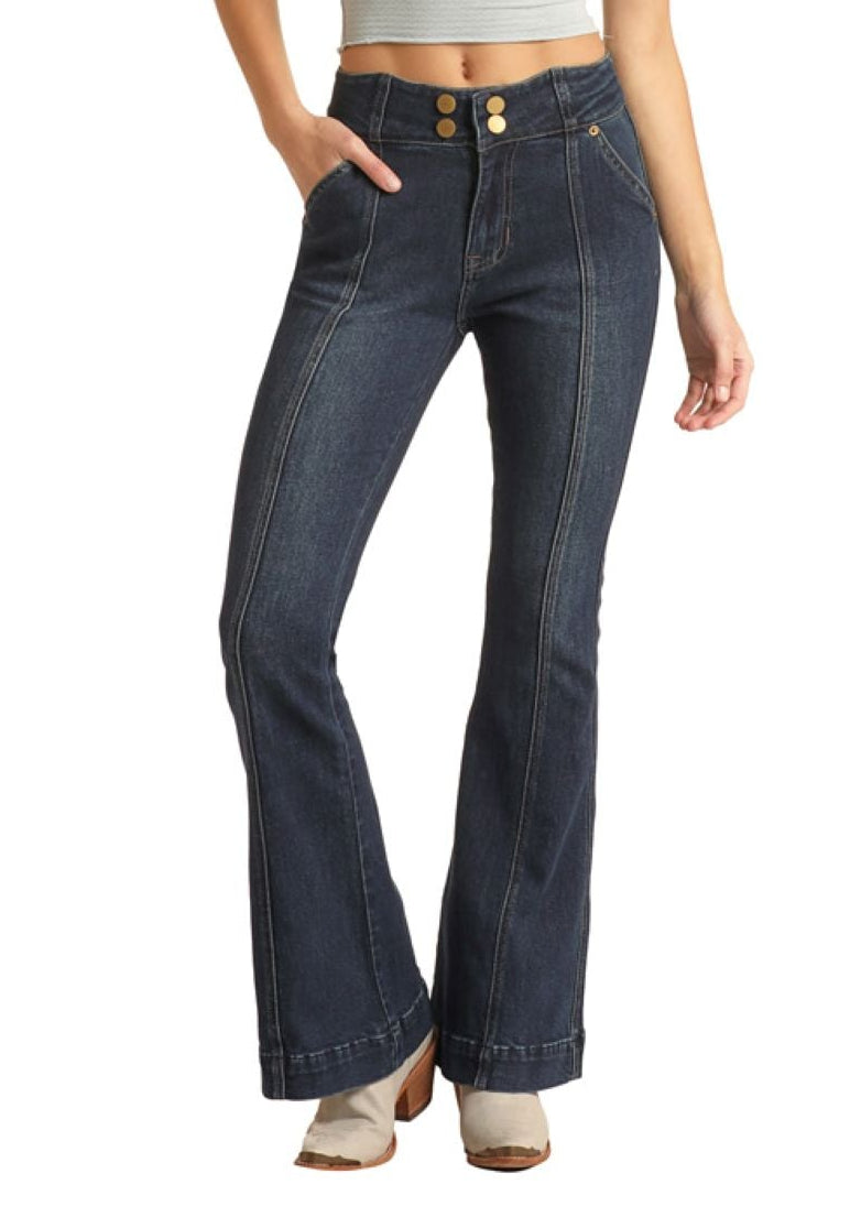 Woman wearing a white tank top, blue jeans, and a beige cowboy hat on a white background