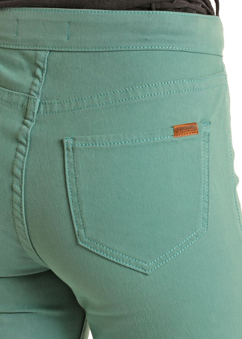 Green pants with a brand label on a white background