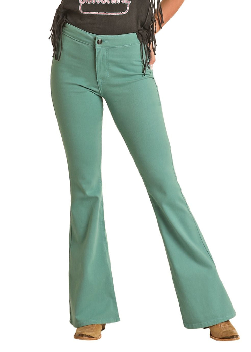 Woman wearing a black tank top with a graphic design and green bell-bottom pants on a white background