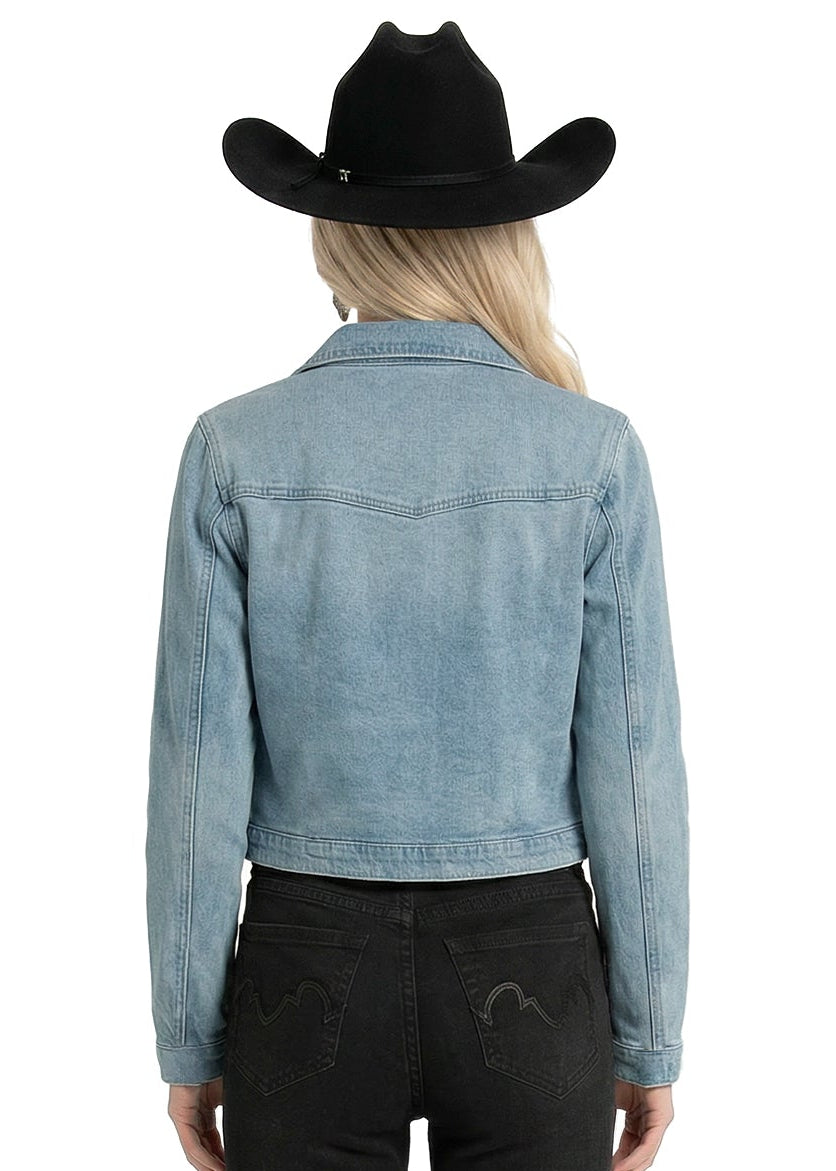 Person wearing a light blue denim jacket and black pants with a black cowboy hat on a white background
