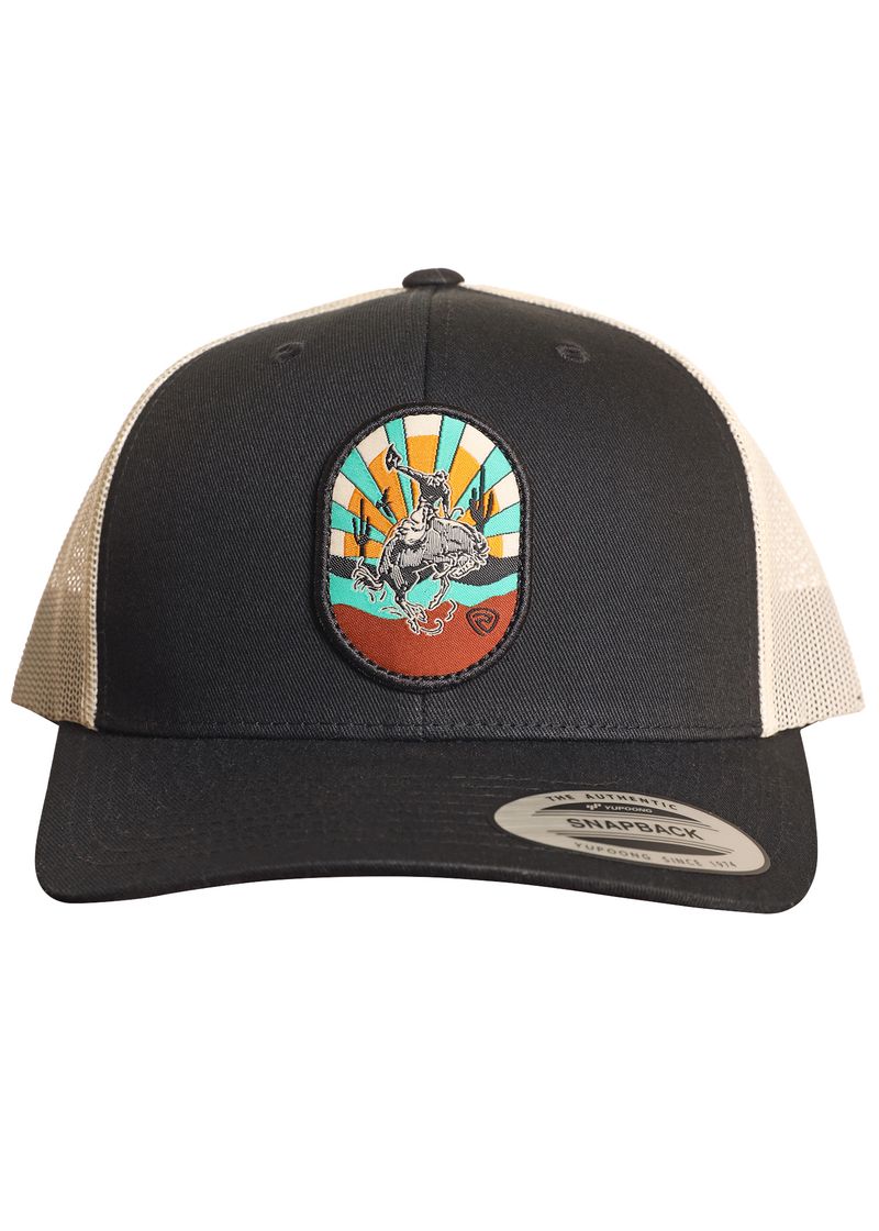 The Buckin' Bronc Cap by Rock & Roll Denim is a black and beige trucker hat with mesh back, adjustable snapback, and a vibrant patch of a bronc rider on a sunburst background. A snapback sticker accents the brim.