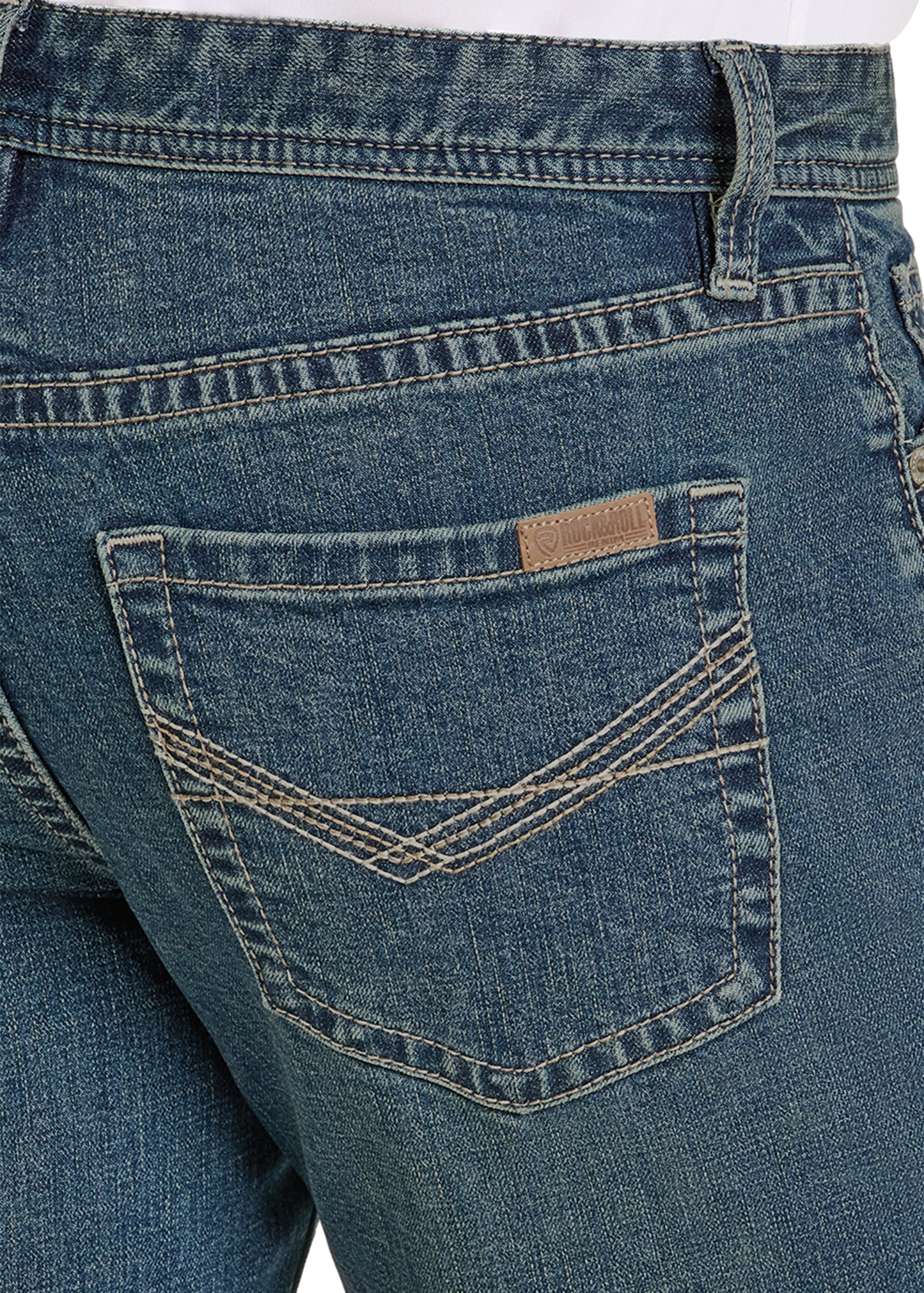 Close-up of blue jeans with a brand label on the pocket.