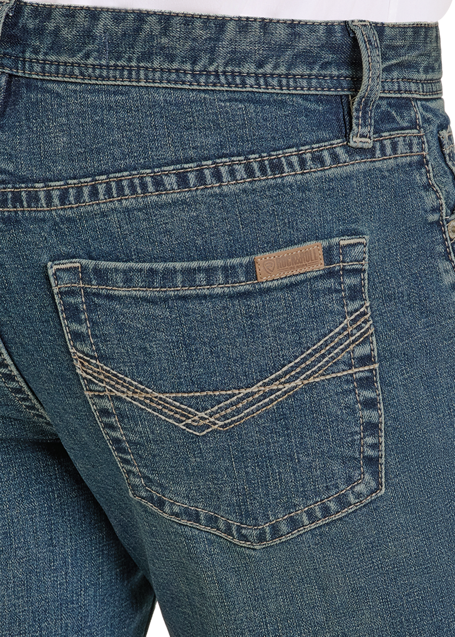 Close-up of blue jeans with a brand label on the pocket.
