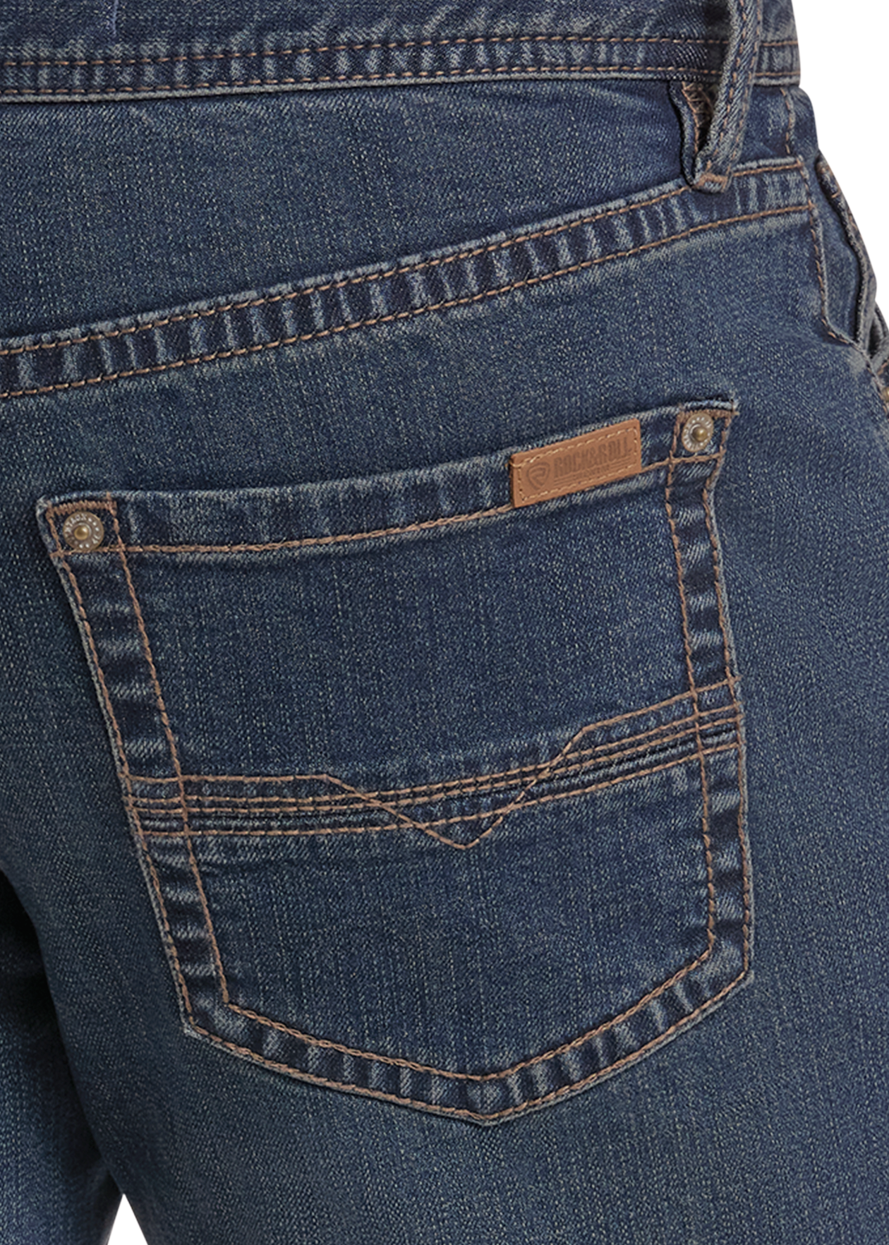 Close-up of the back waistband and right back pocket of dark blue denim jeans, showing contrast tan stitching and a small leather brand tab on the pocket.