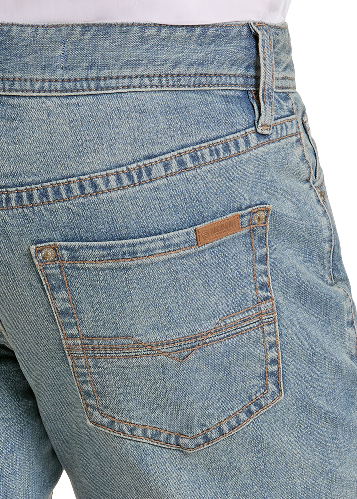 Close-up of the back waistband and pocket area of light blue denim jeans, showing a tan leather brand tab on the back pocket.