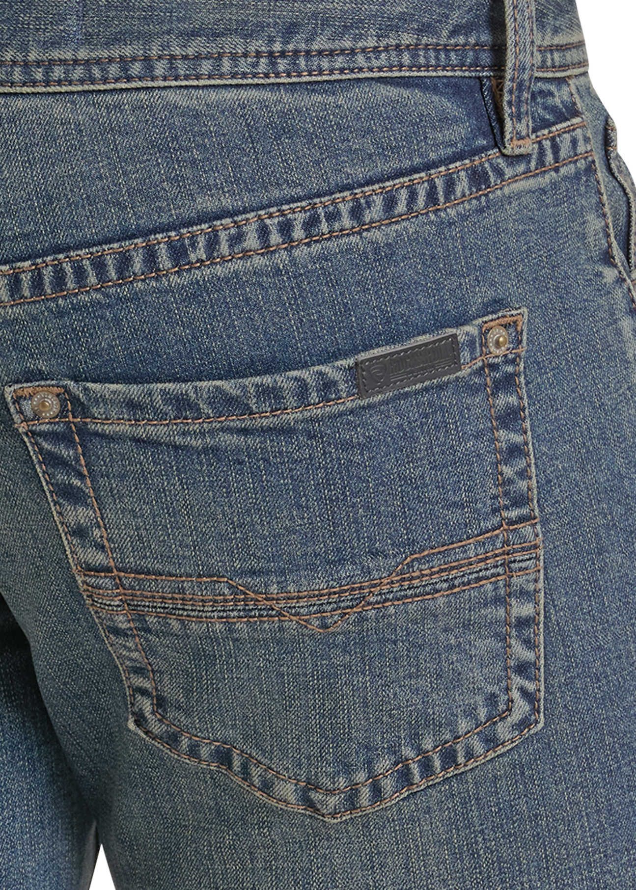 Close-up of the back pocket of blue denim jeans, showing the stitching, button, rivet, and a small dark brand tab on the pocket.