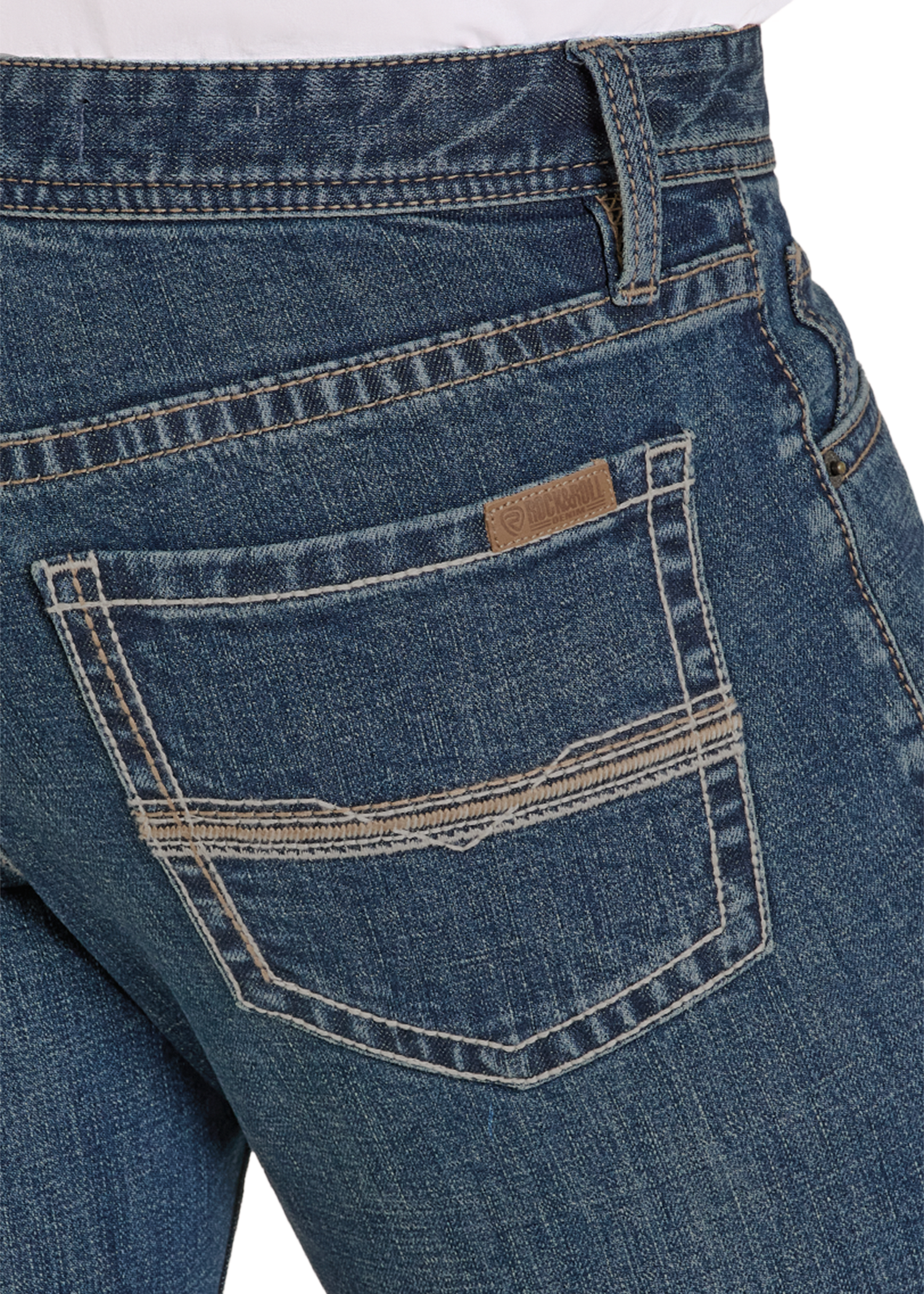 Close-up of blue jeans with a brand label on the pocket against a white background