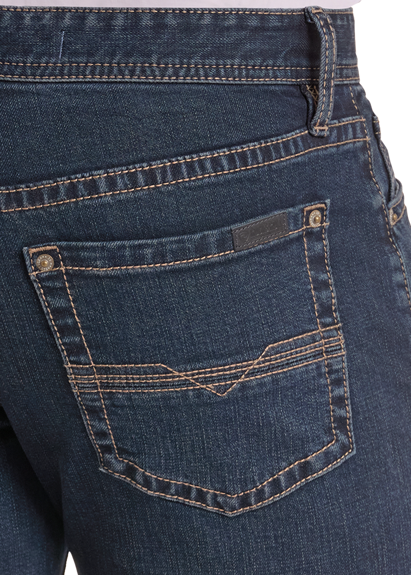 Close-up of the back pocket of dark blue denim jeans, showing contrast tan stitching and metal rivets, with a light-colored top hem visible at the top edge.