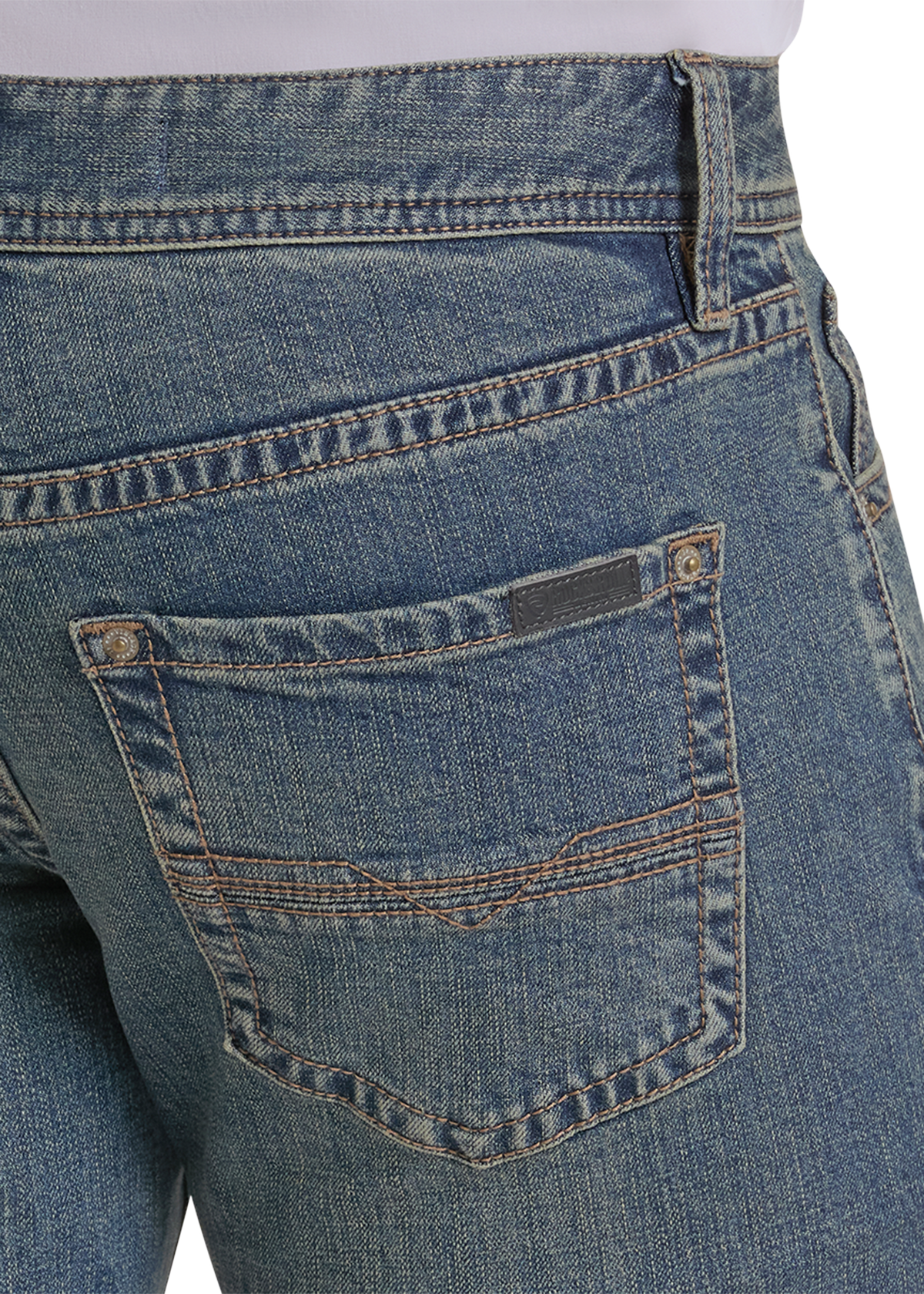 Close-up of the back pocket of blue denim jeans.