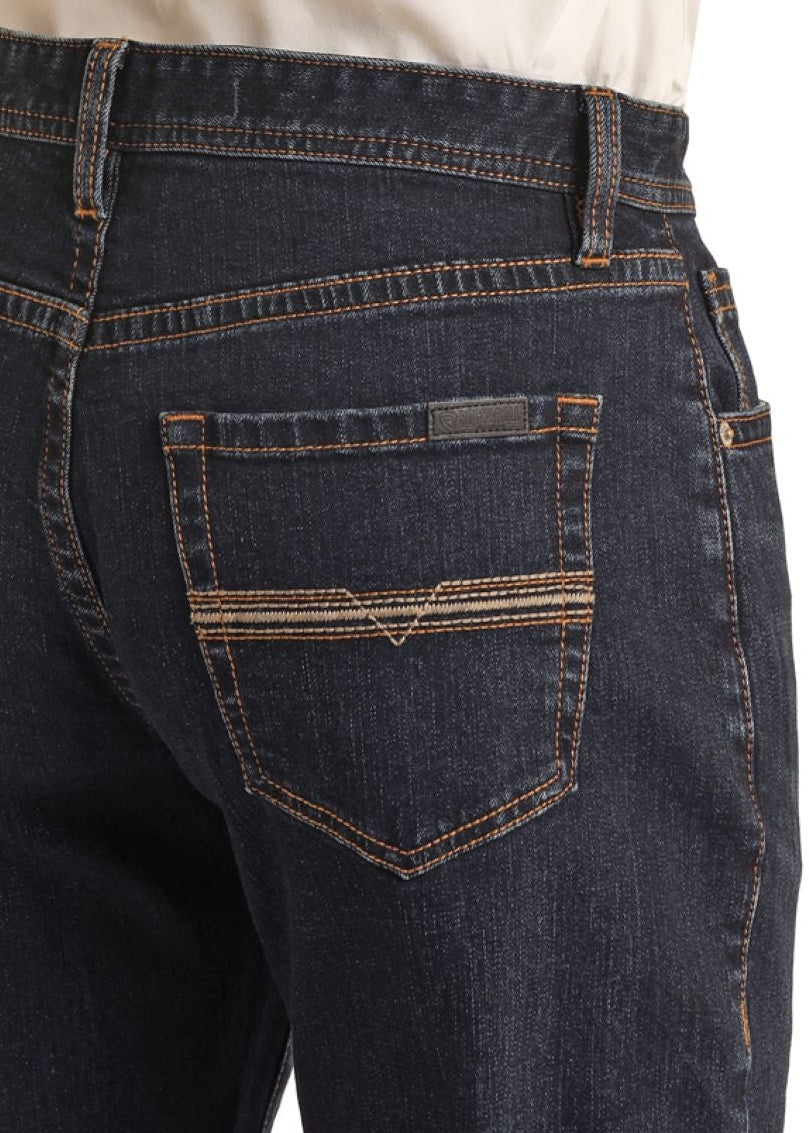 Dark blue jeans with brown stitching on a white background