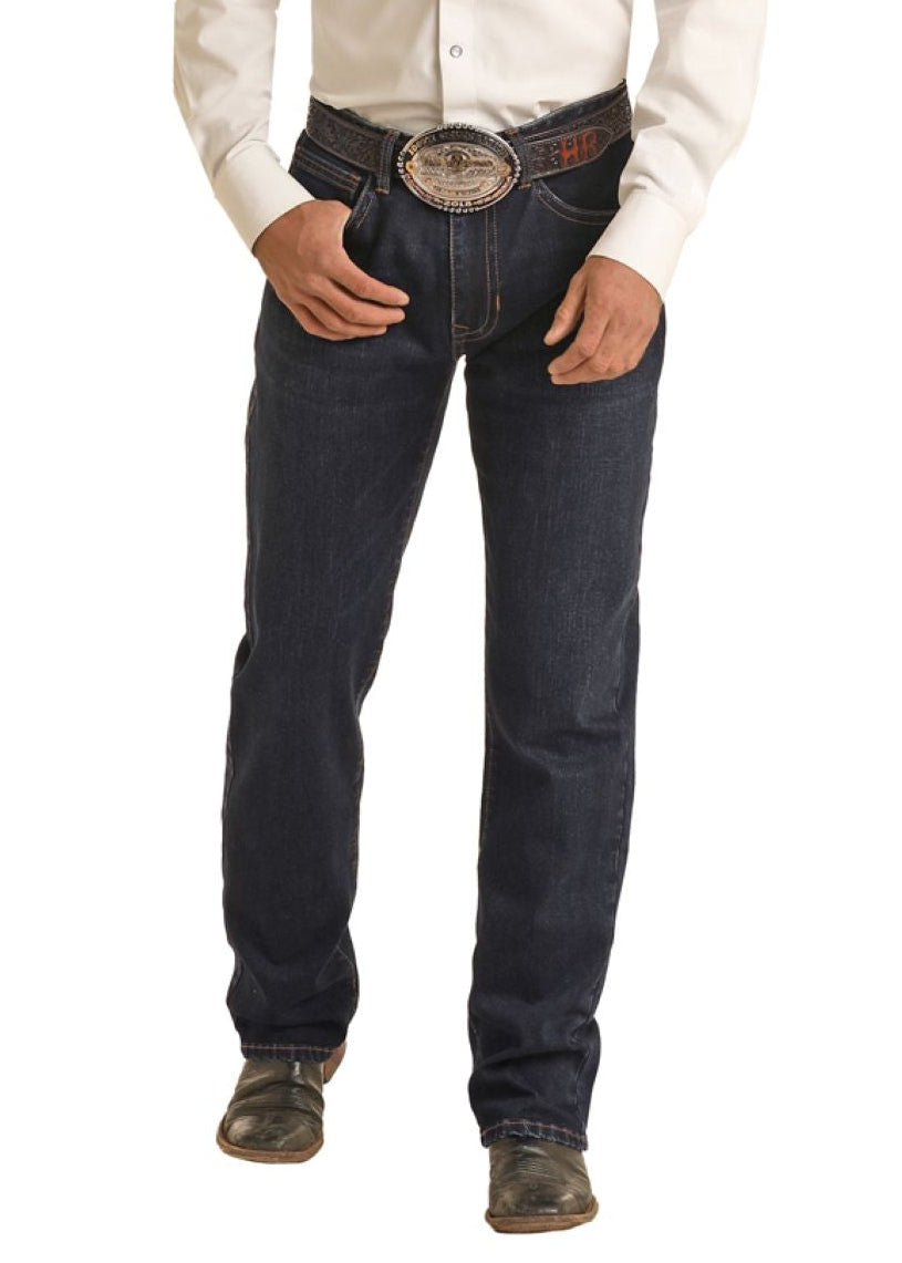 Man wearing a cowboy hat, white shirt, and dark jeans on a white background