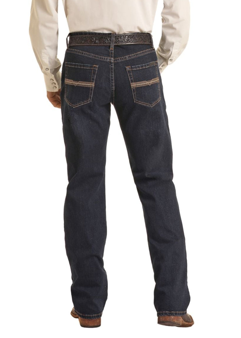 Man wearing a cowboy hat, white shirt, and dark jeans on a white background