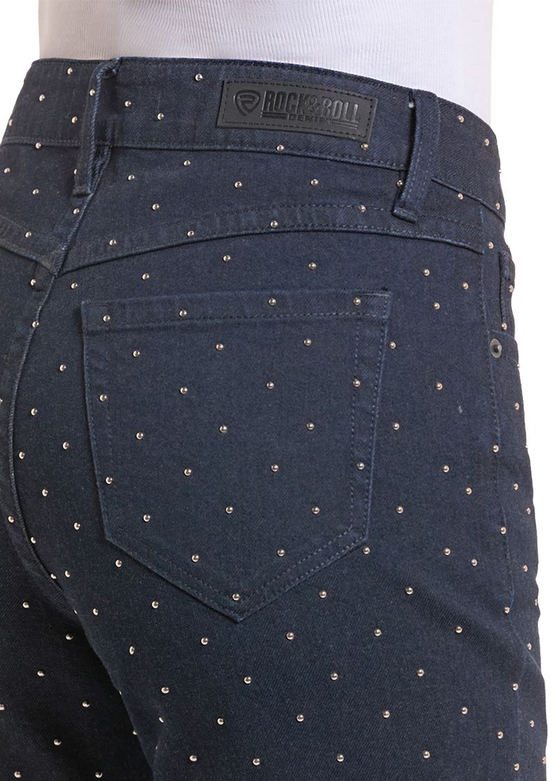 Close up of a dark wash studded denim pocket,