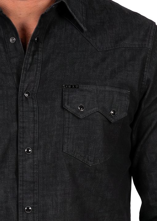 Close up of a denim pearl snap Koe Wetzel shirt. 