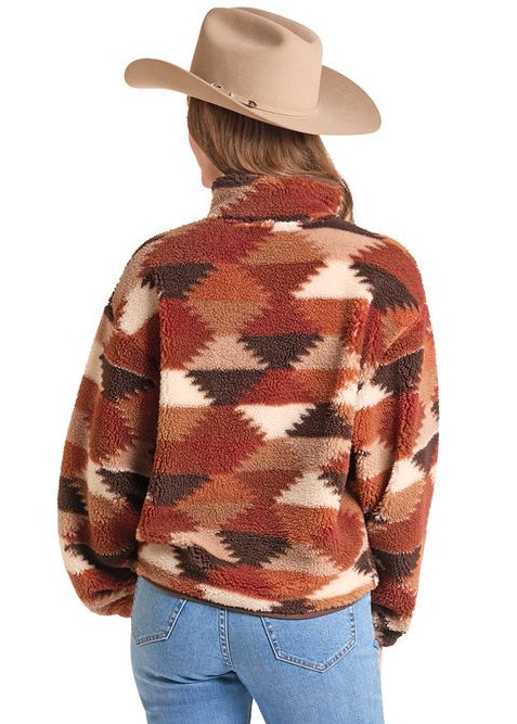 Back view of a women wearing a patterned sherpa pullover.
