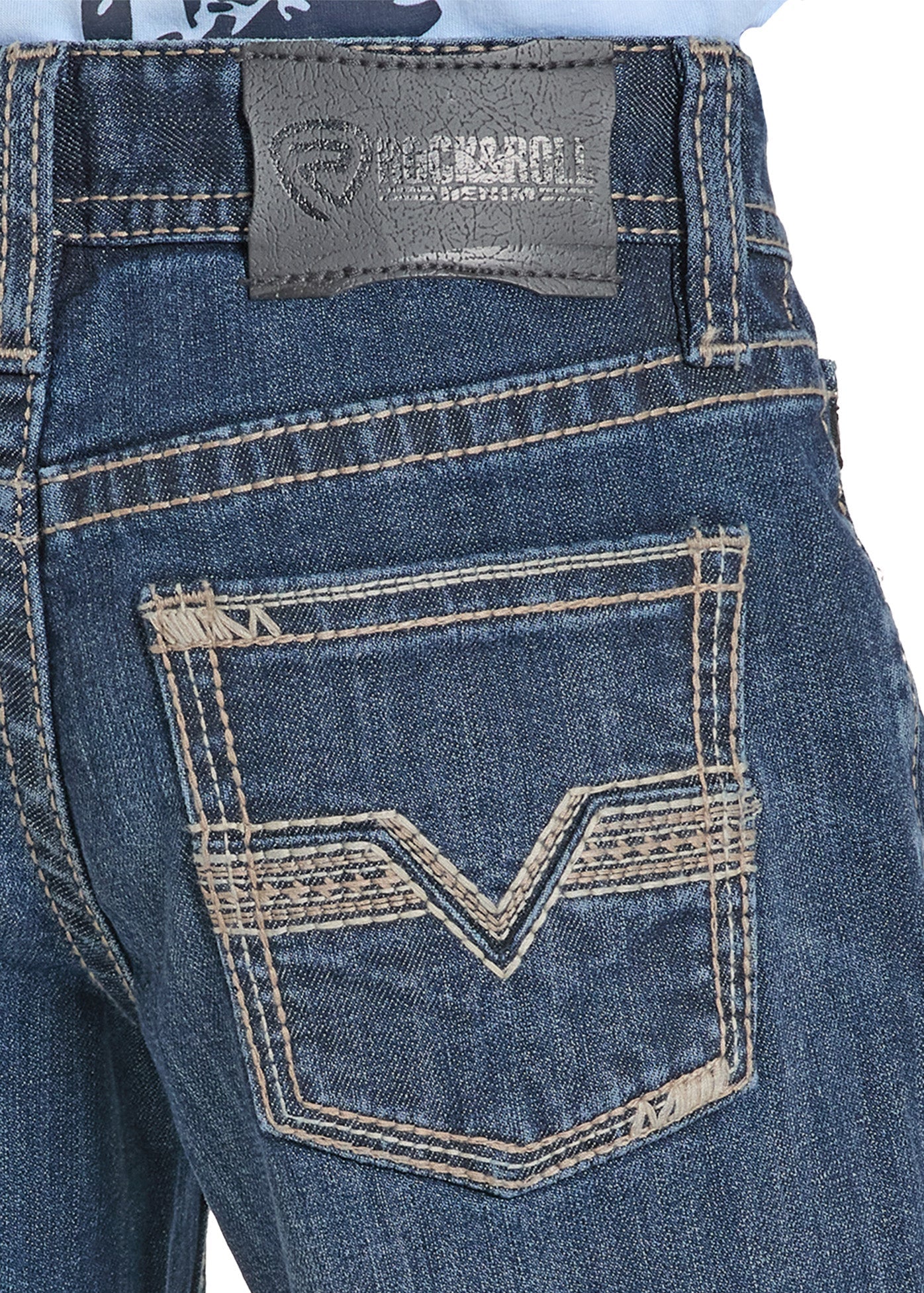 Close-up of blue jeans with a brand label on a white background
