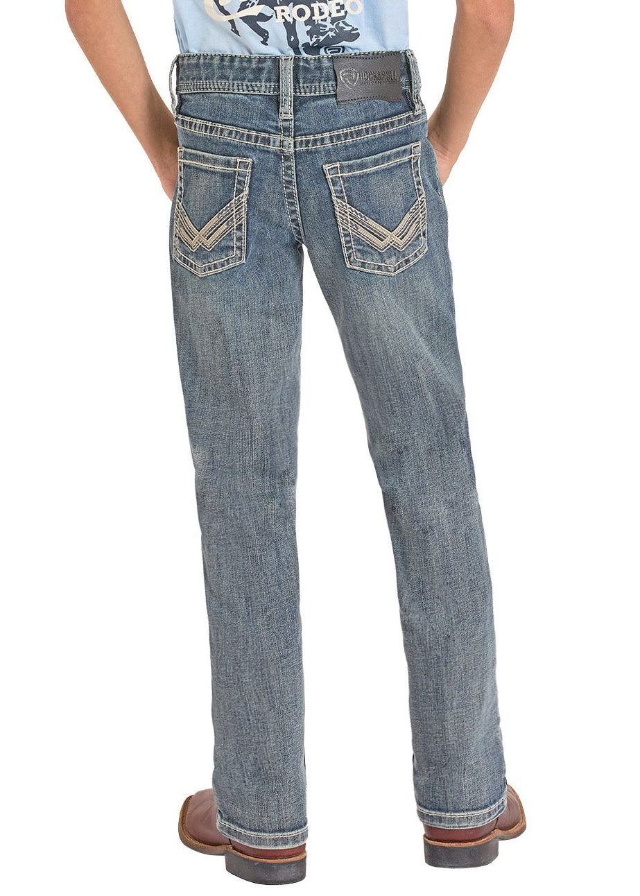 Person wearing a light blue t-shirt with graphic design and jeans, standing against a white background