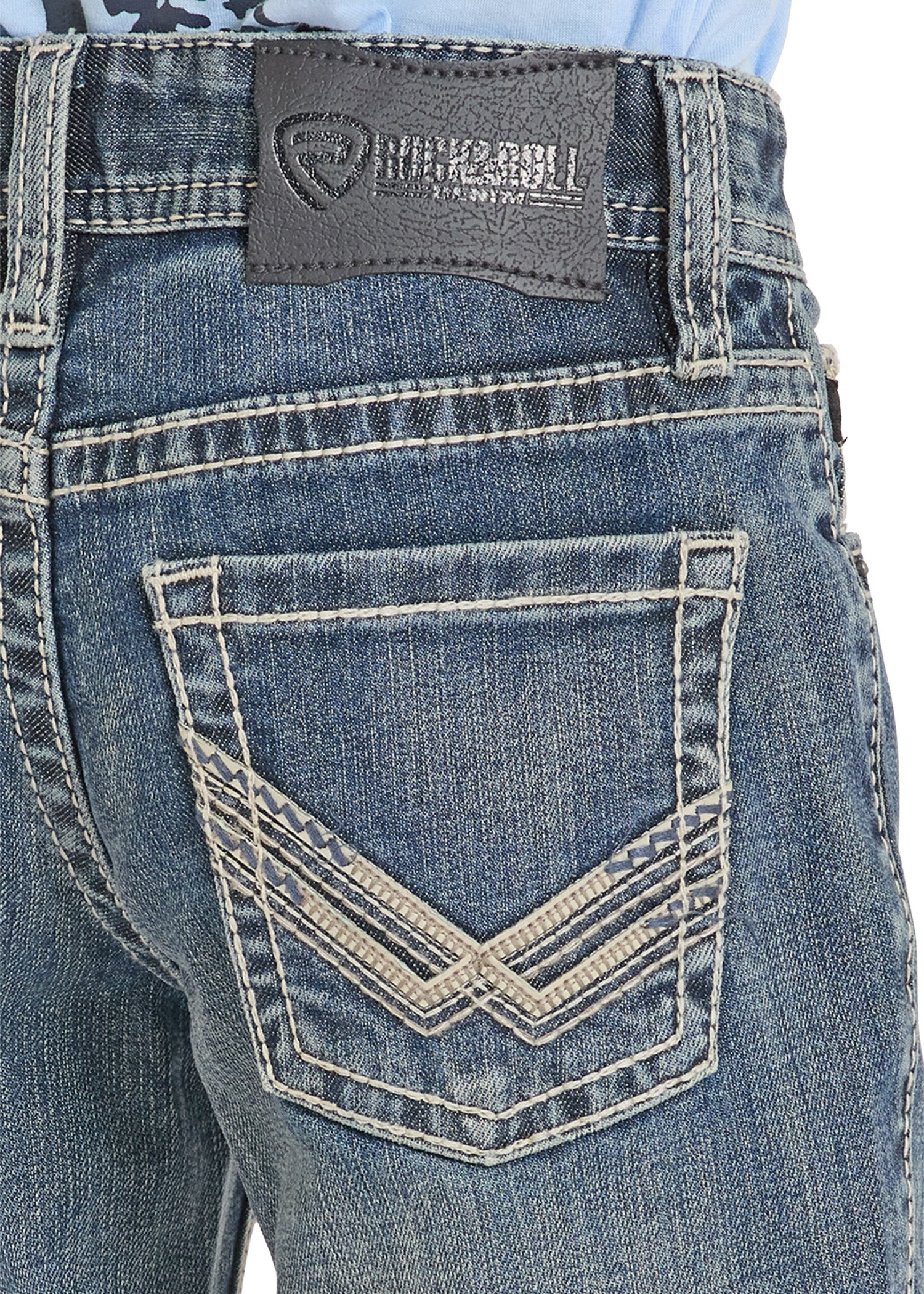 Close-up of blue jeans with a brand label on the back pocket.