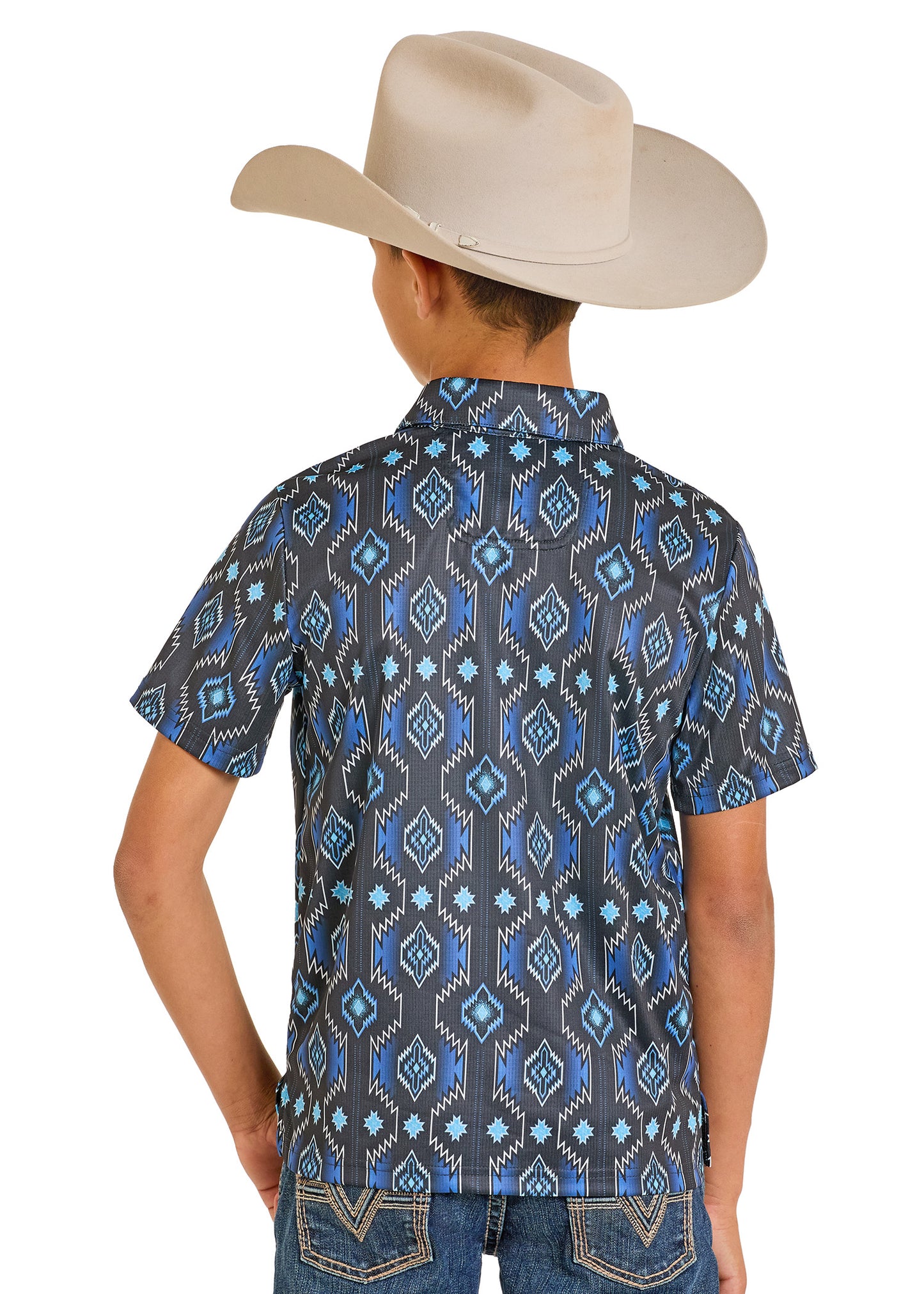Child wearing a patterned shirt and cowboy hat on a white background