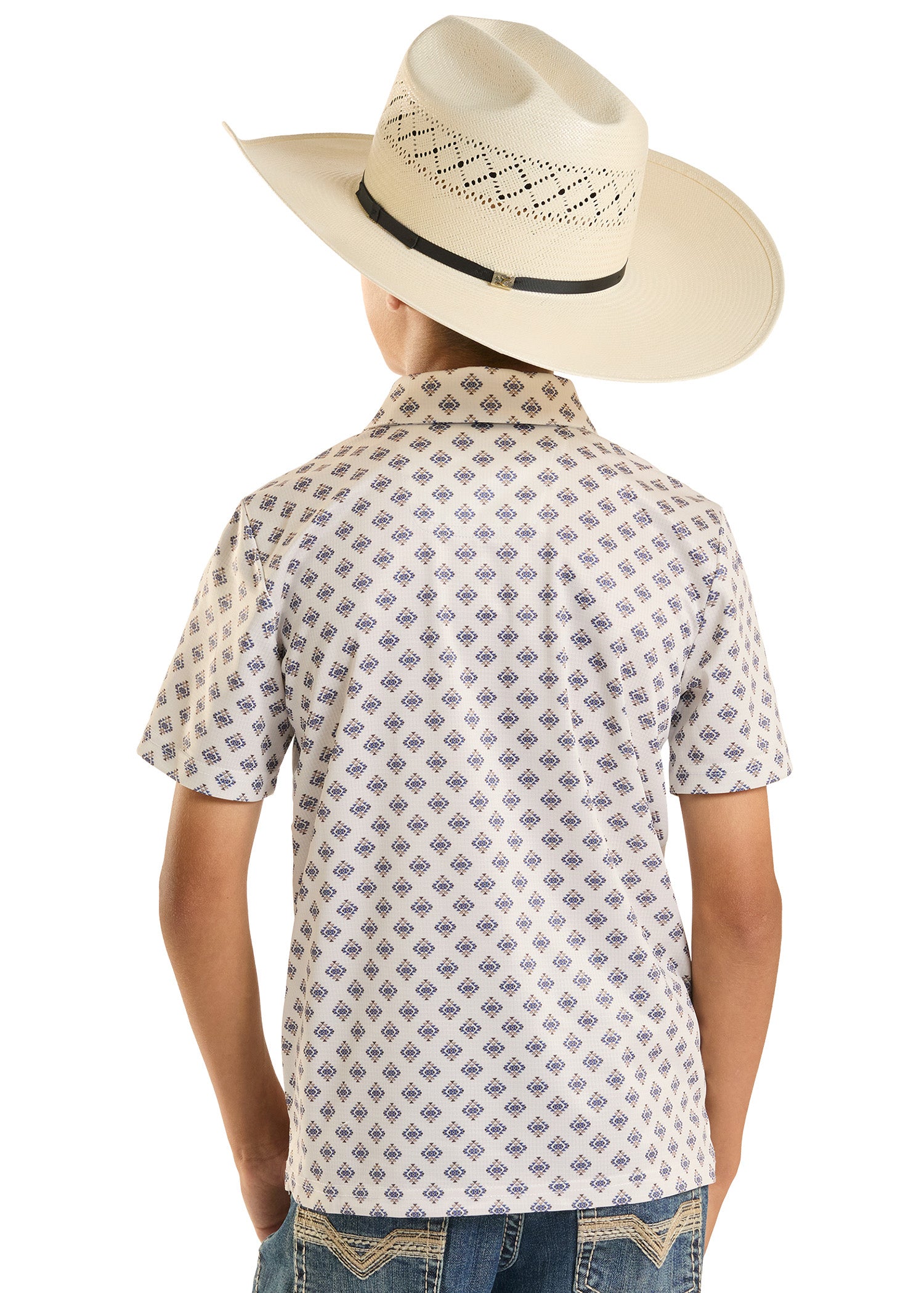 Child wearing a patterned shirt and cowboy hat on a white background