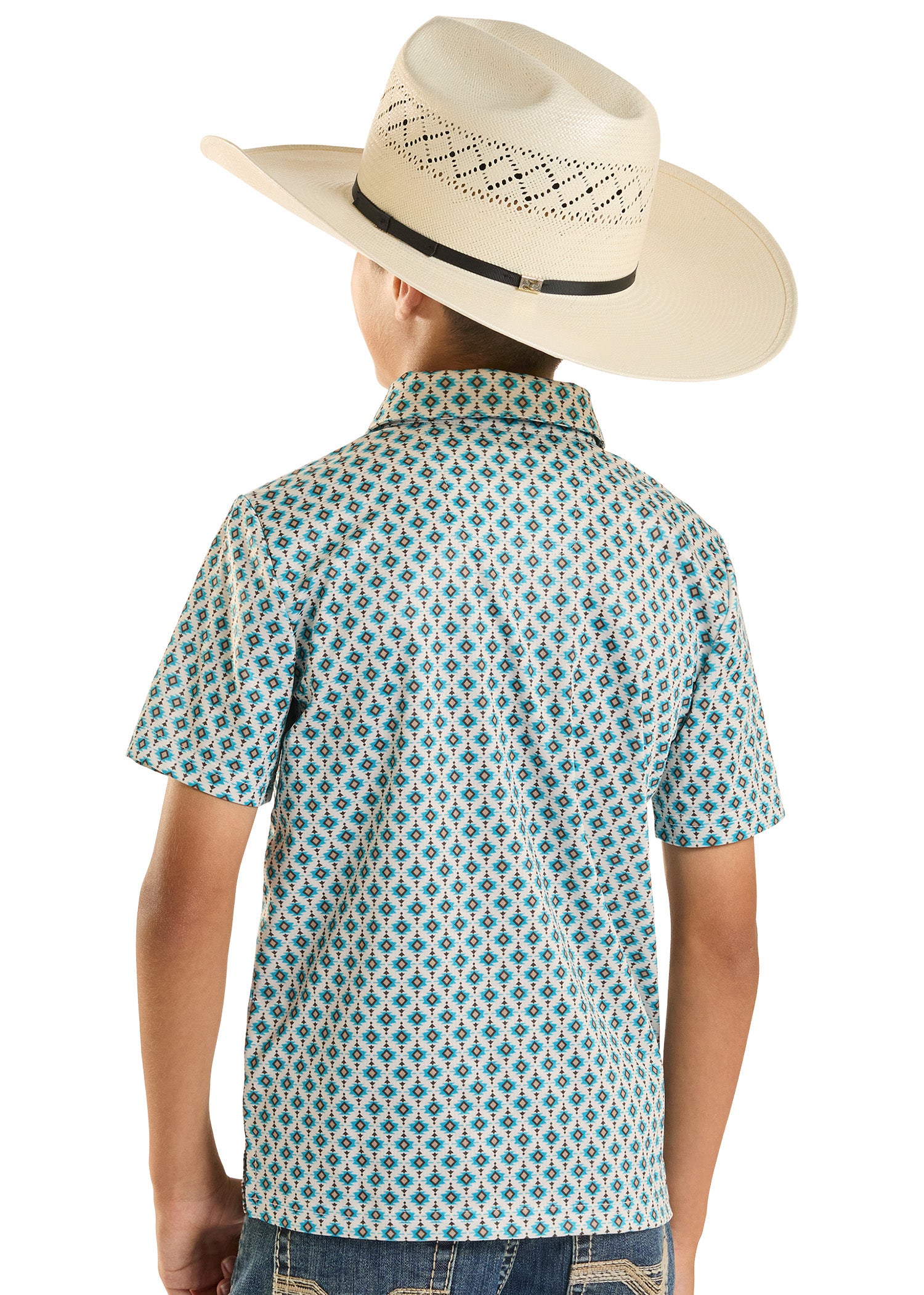 Person wearing a patterned shirt and cowboy hat on a plain background