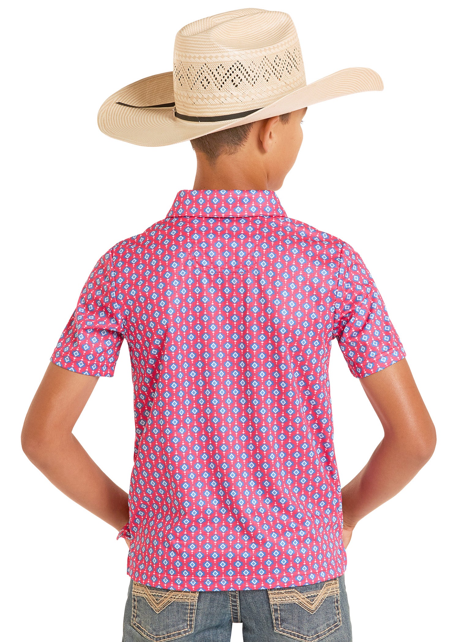 Child wearing a pink patterned shirt and cowboy hat on a white background