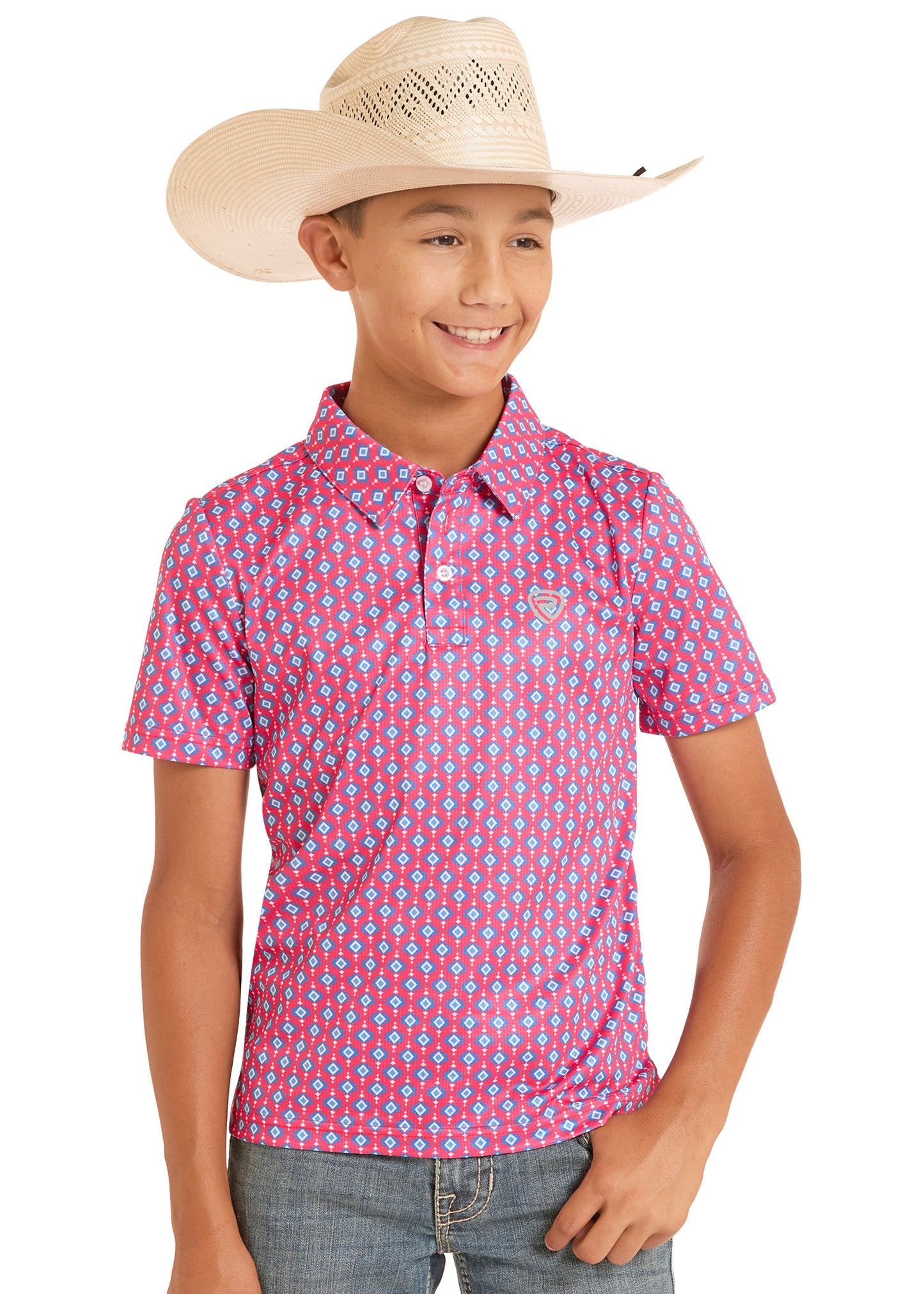 Child wearing a pink patterned polo shirt and beige cowboy hat on a white background