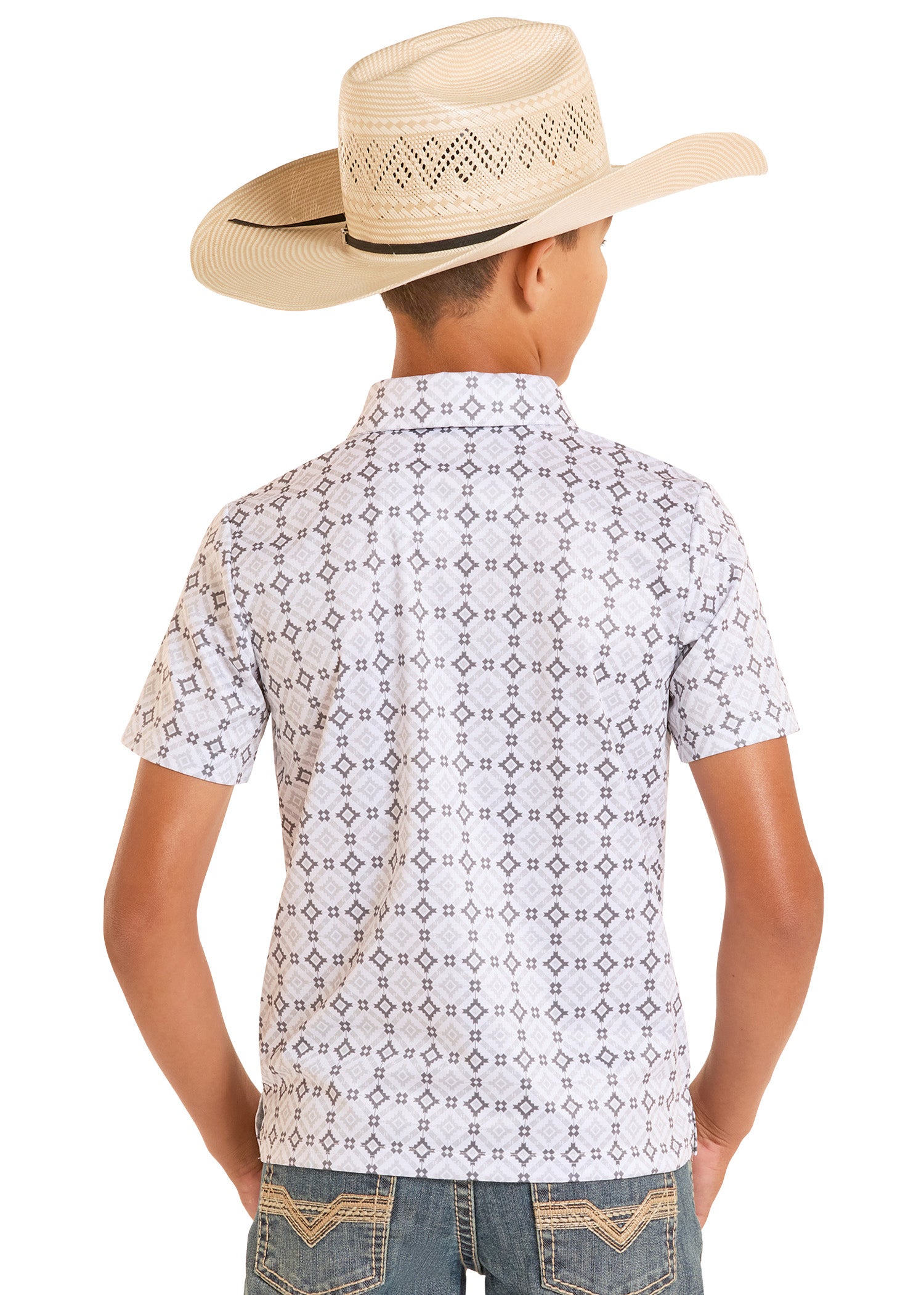 Child wearing a patterned shirt and cowboy hat on a white background