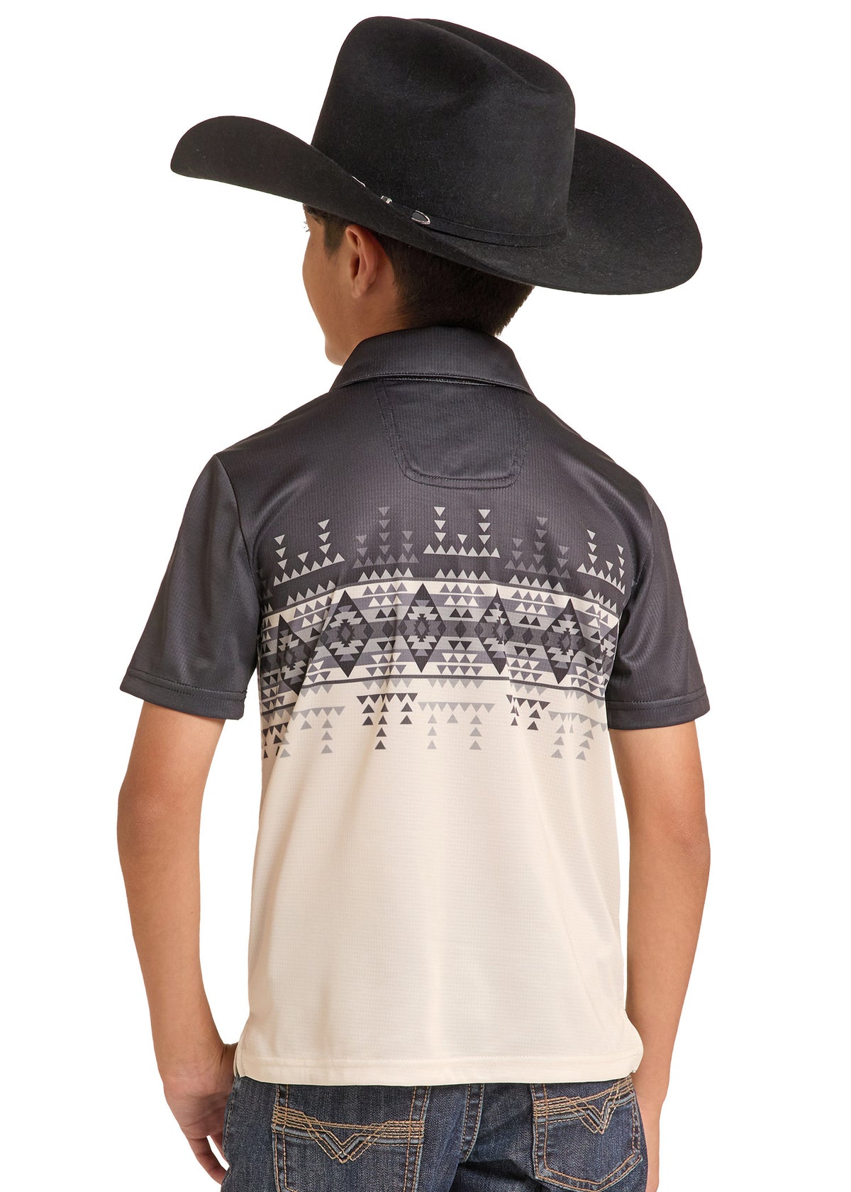 A child model from the back wearing a dark gray and cream short-sleeve polo shirt with a geometric pattern across the upper back, paired with a black cowboy hat and blue jeans, on a white background.