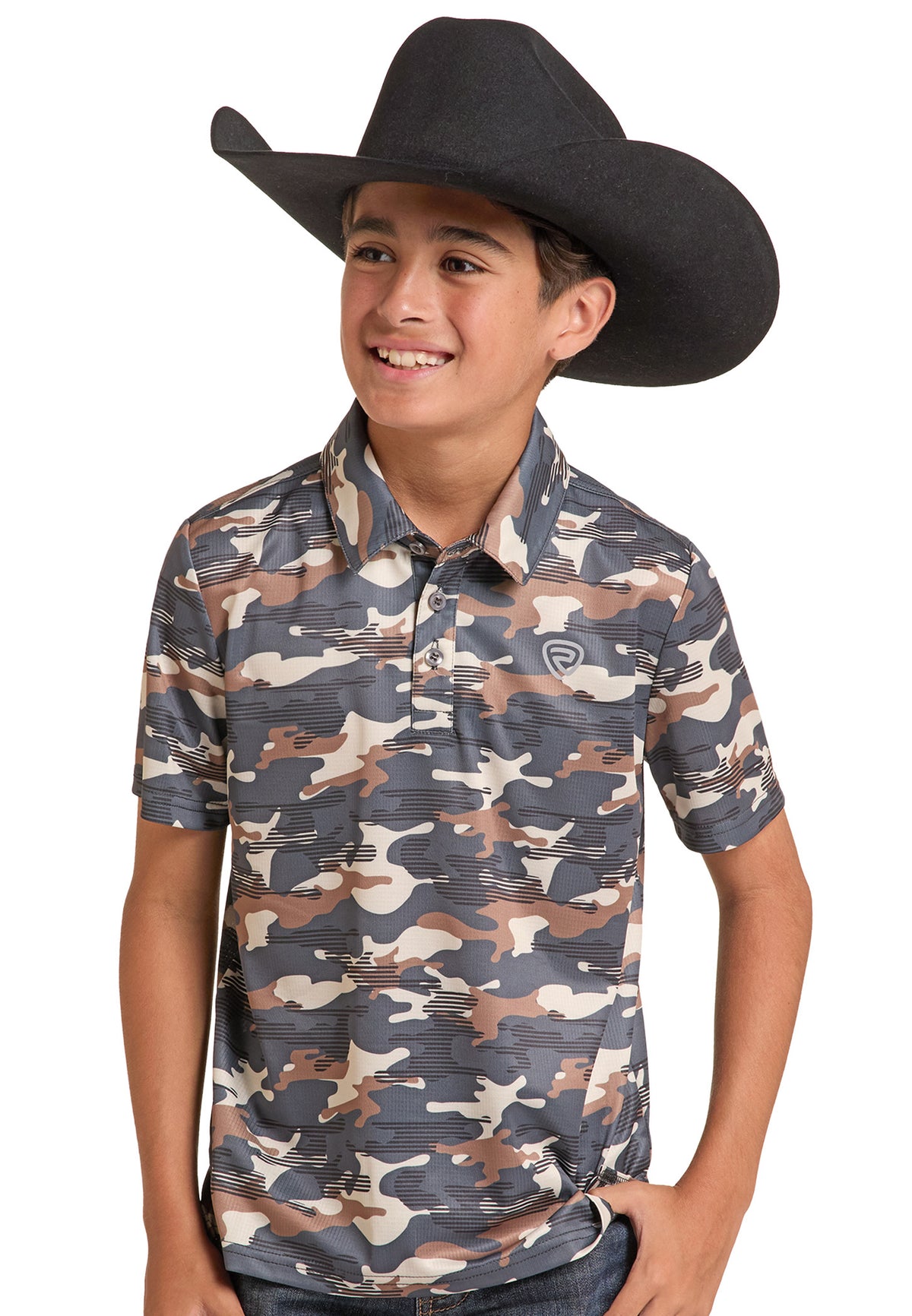 A young boy wearing a black cowboy hat and a short-sleeve polo shirt with a brown, beige, and gray camouflage pattern, posed against a solid white background.
