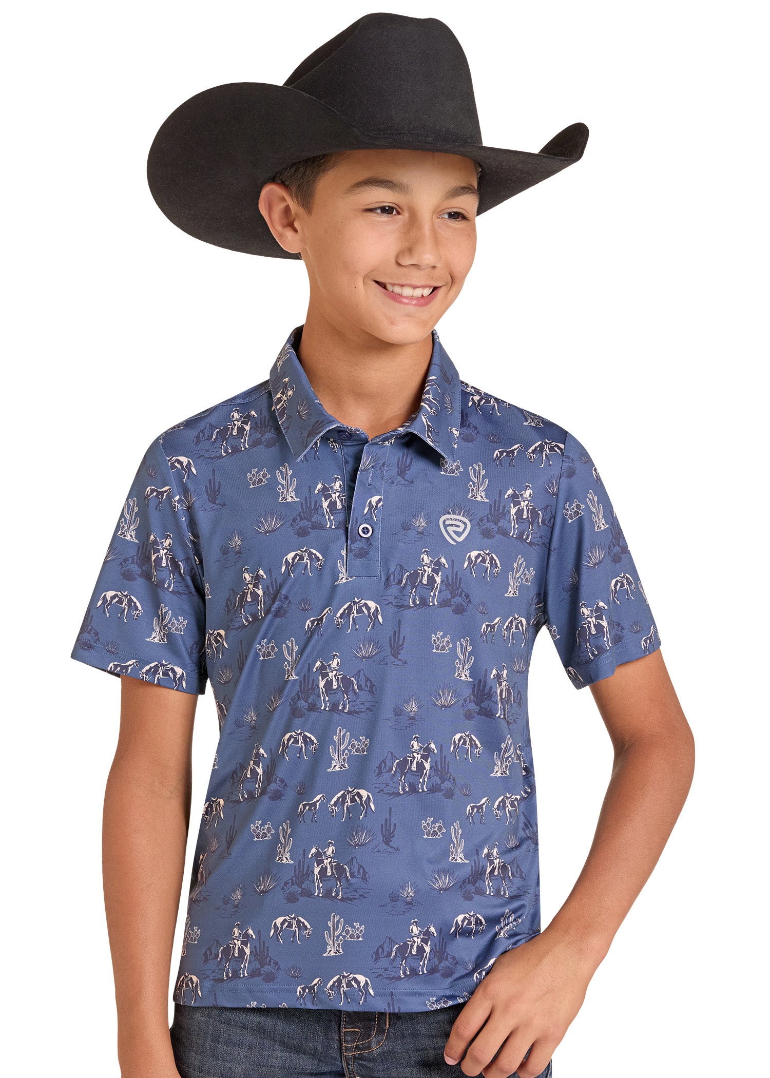 A young boy wearing a black cowboy hat and a blue short-sleeve button-up shirt with a white western-themed cowboy print.